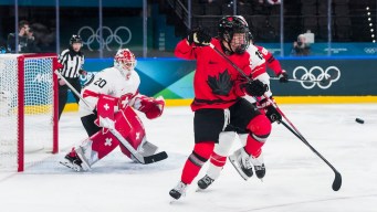 Jenn Gardiner competes in ice hockey.