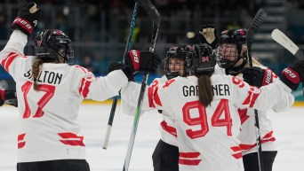 Kristin O'Neill and her teammates celebrate after scoring