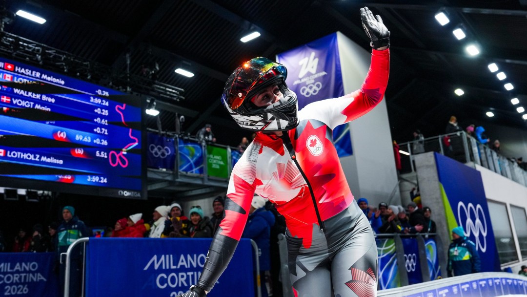 Team Canada's Melissa Lotholz reacts as she arrives at the finish line