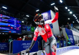 Team Canada's Melissa Lotholz reacts as she arrives at the finish line