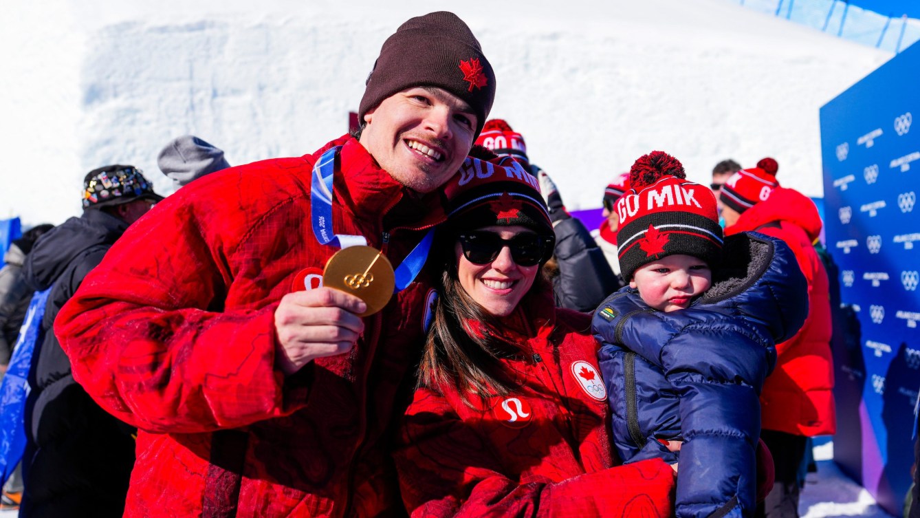 Team Canada’s Mikael Kingsbury celebrates with his family after winning a gold medal