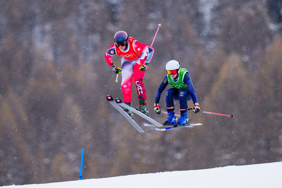 Team Canada’s Marielle Thompson leads ahead of Sweden's Linnea Mobaerg in the freestyle skiing women's ski cross 1/8 finals