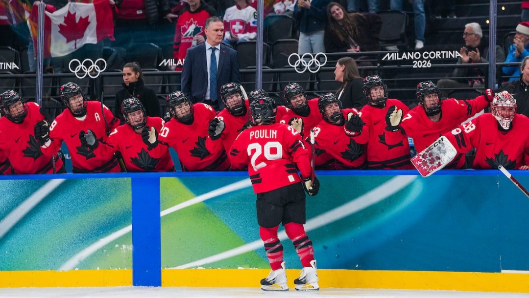 Marie-Philip Poulin celebrates her goal with teammates