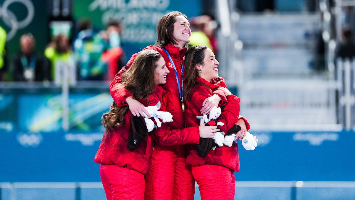 Isabelle Weidemann, Valerie Maltais, and Ivanie Blondin celebrate on the podium