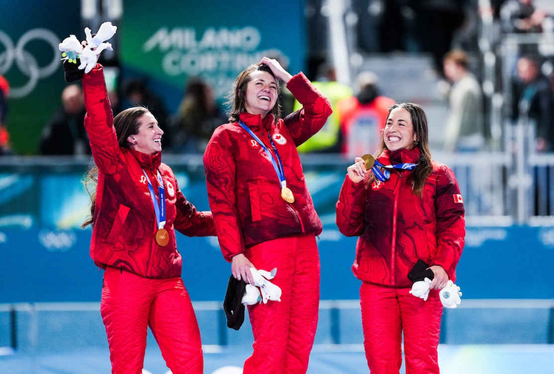 Isabelle Weidemann, Valerie Maltais, and Ivanie Blondin celebrate on the podium