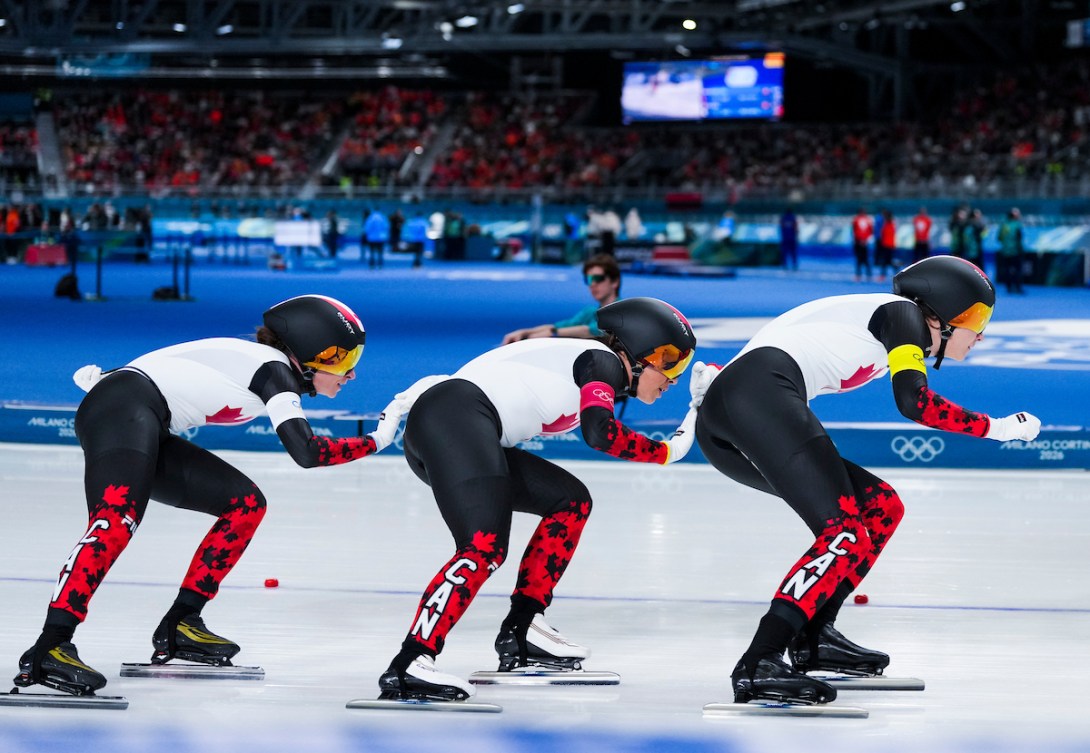 Isabelle Weidemann, Valerie Maltais, and Ivanie Blondin skate in the team pursuit