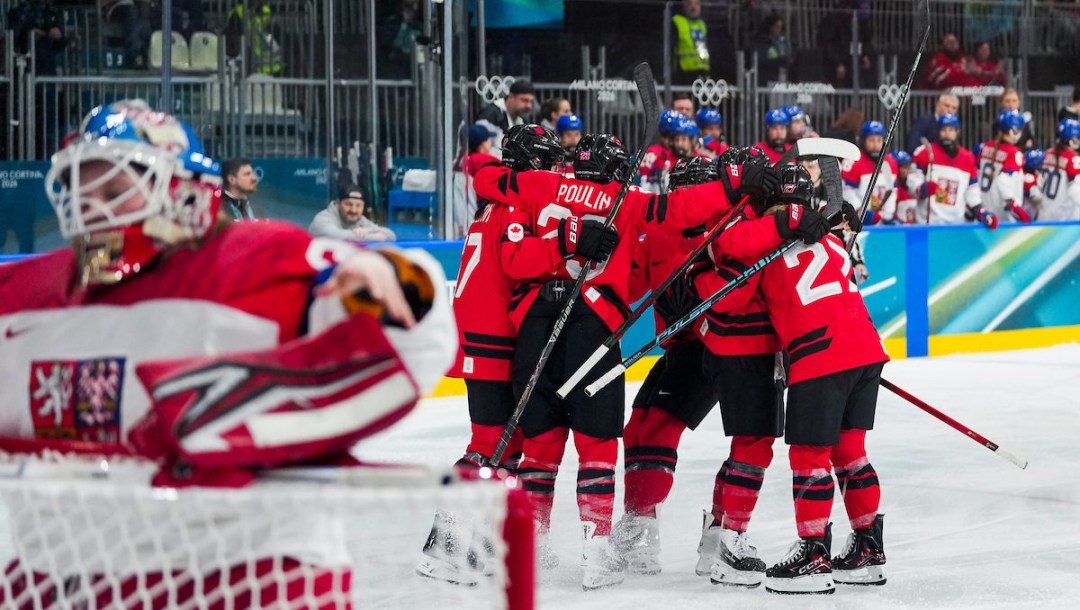 Team Canada's Kristin O'Neill celebrates with teammates