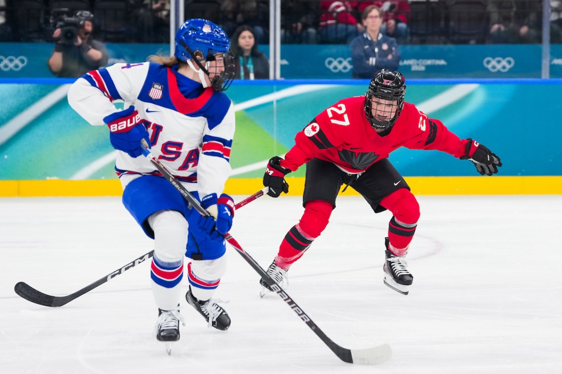 Emma Maltais defends against Caroline Harvey