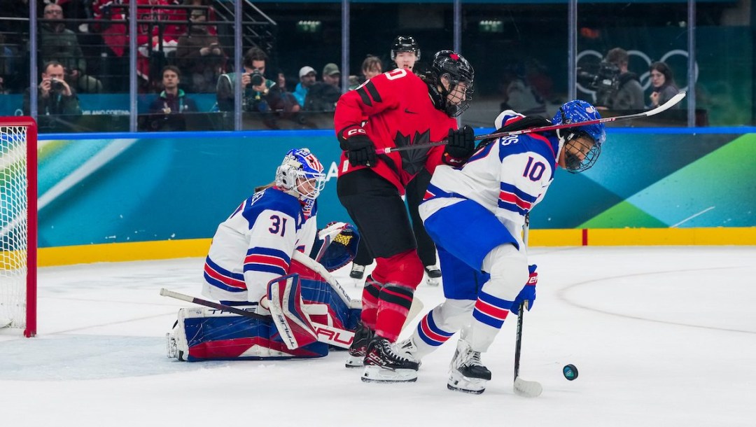 Sarah Nurse battles in front of the net against United States' Laila Edwards