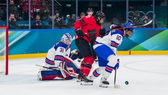 Sarah Nurse battles in front of the net against United States' Laila Edwards
