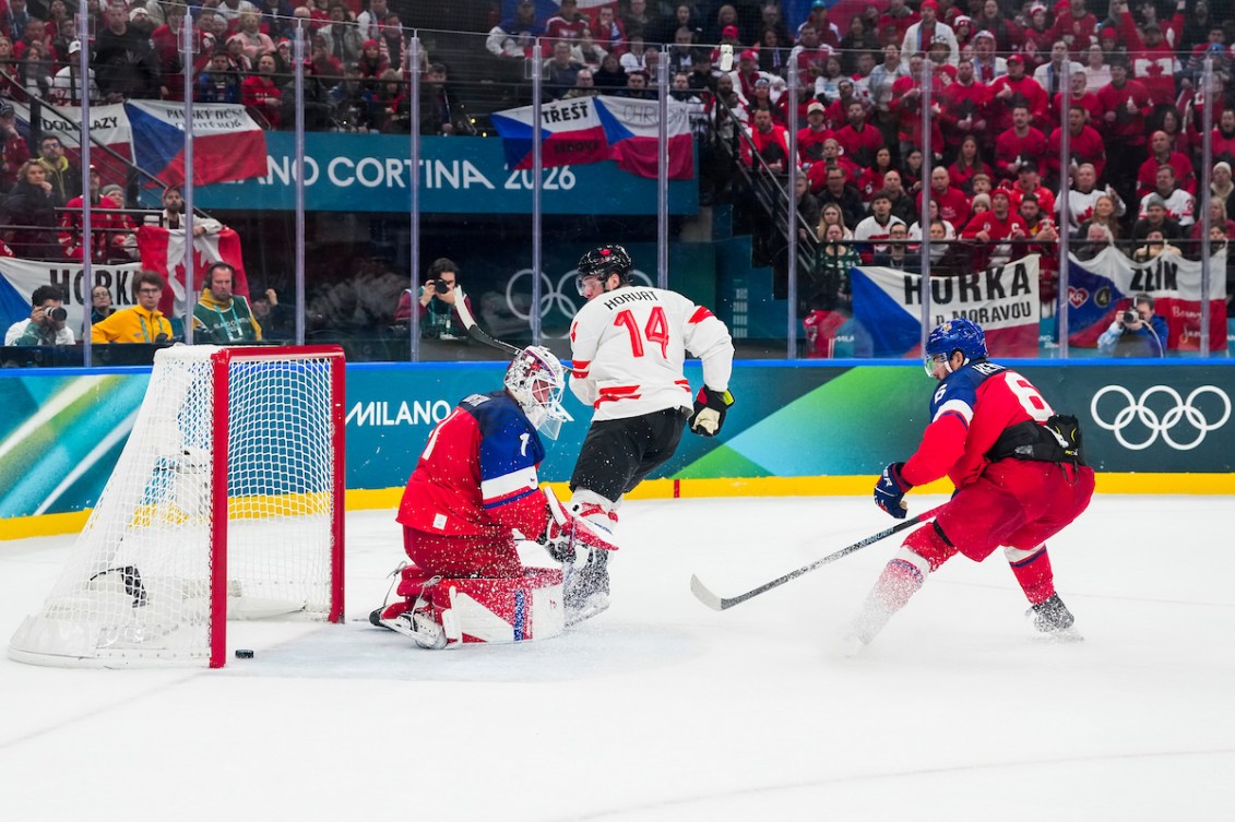 Bo Horvat scores a goal against Lukas Dostal