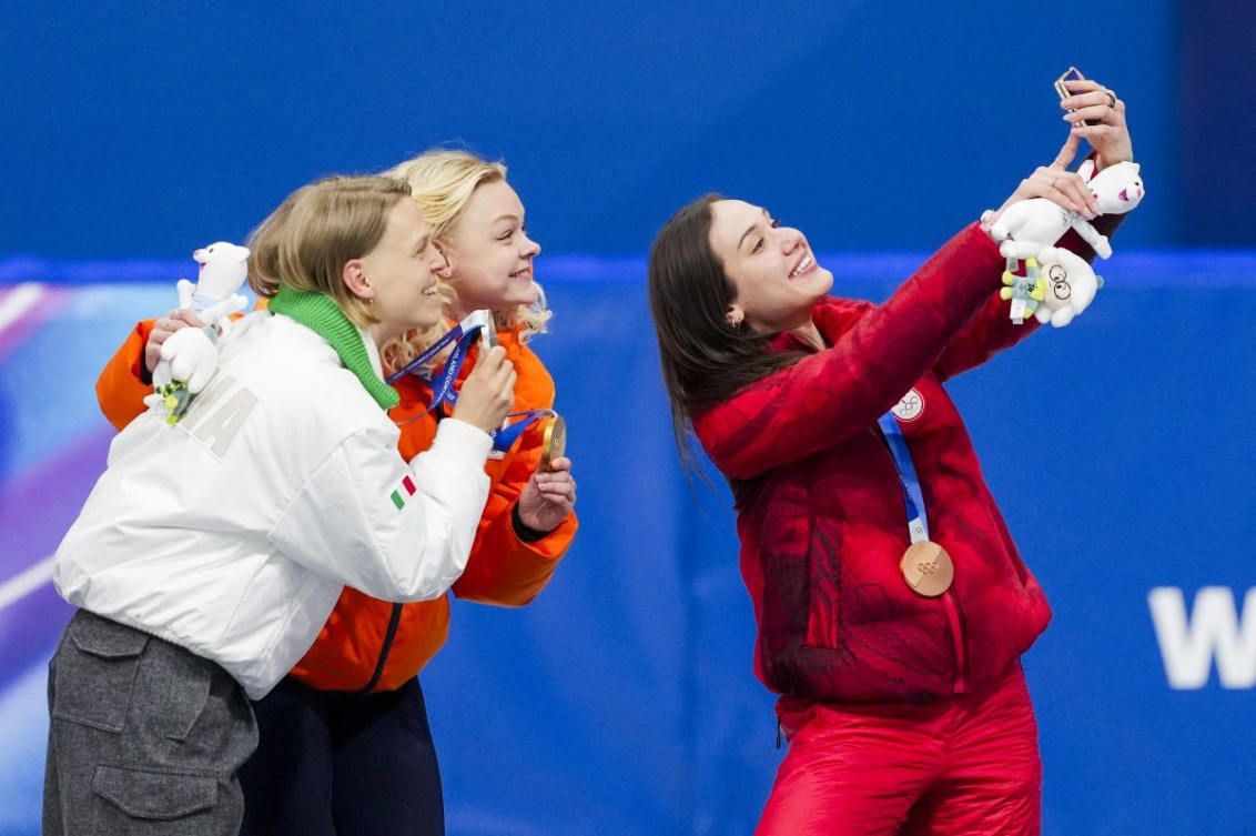 Alt text: Team Canada’s Courtney Sarault celebrates after winning a bronze medal in the 500m short track speed skating final at the Milano Cortina 2026 Olympic Winter Games. Photo by Leah Hennel/COC