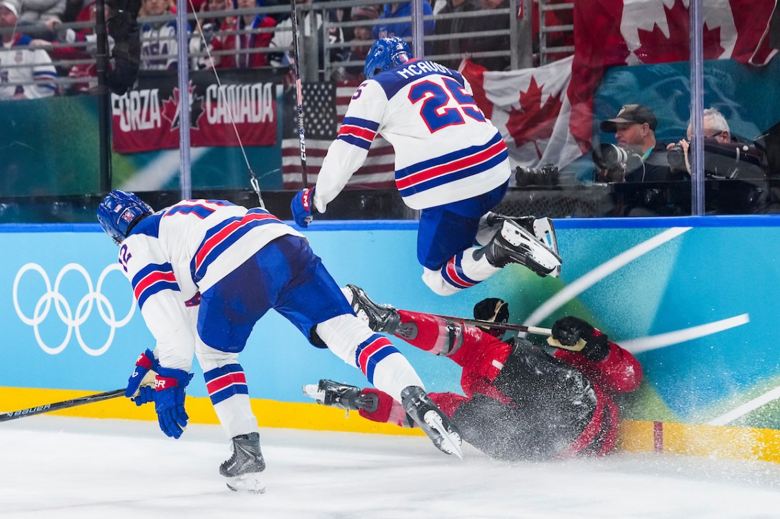 Tom Wilson crashes into the boards