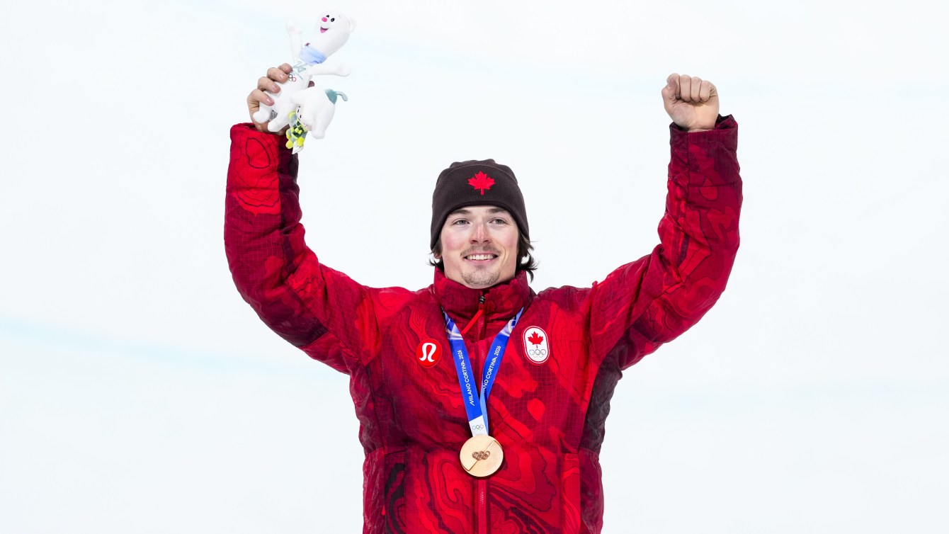 Team Canada's Brendan MacKay celebrates winning a bronze medal in freestyle skiing men's freeski halfpipe