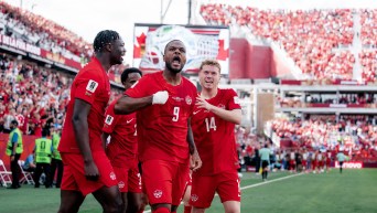 Cyle Larin and teammates celebrate after his goal against Bosnia and Herzegovina on Friday