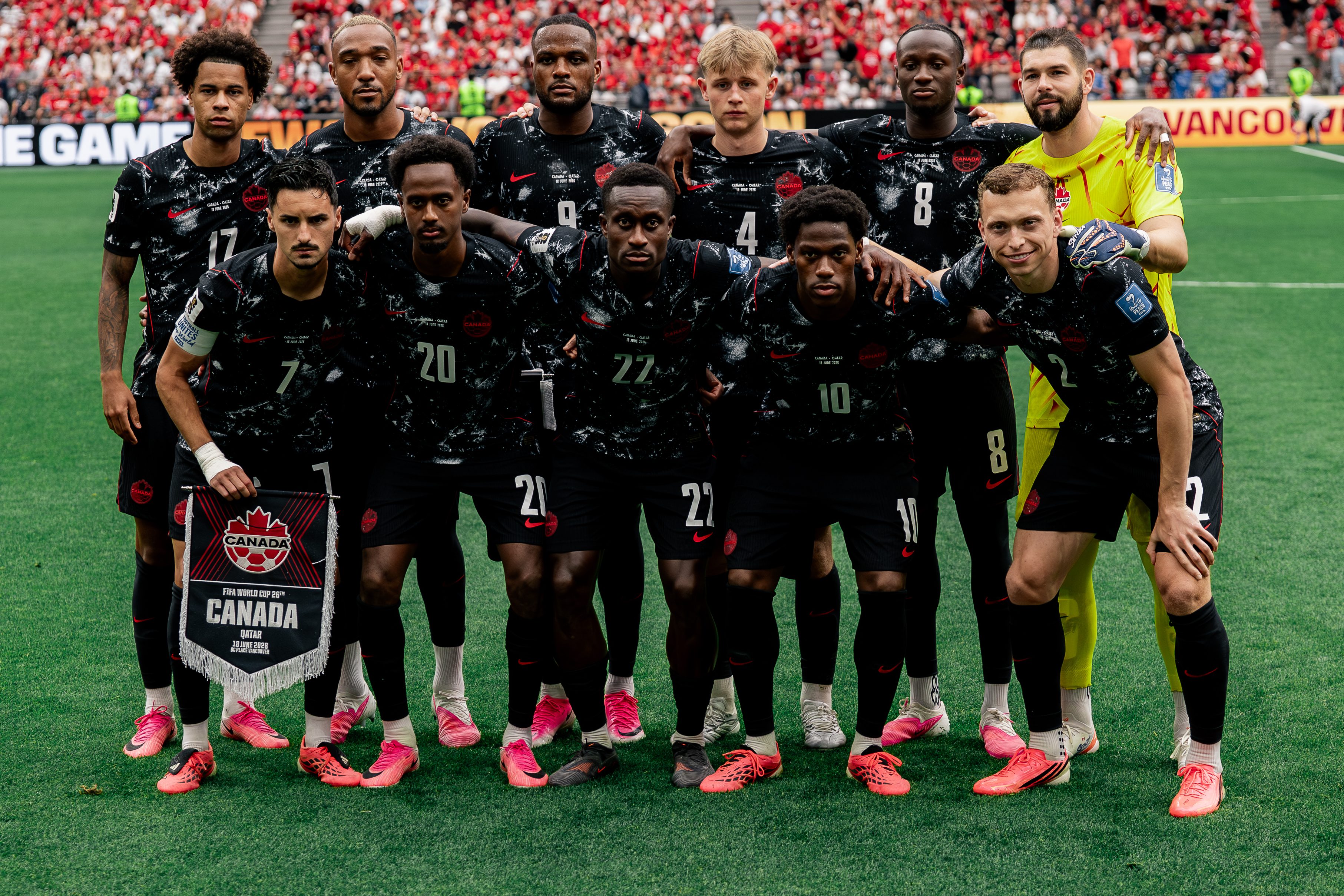 Canada's players pose ahead of the match against Qatar.