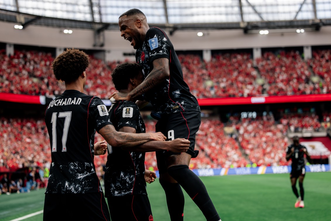 Canada players celebrate after a goal against Qatar on Thursday.