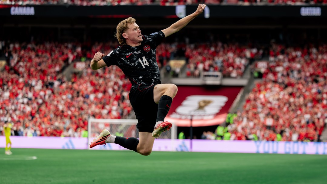 Jacob Shaffelburg celebrates a Canada goal against Qatar at the FIFA World Cup