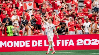 Canada defender Alistair Johnston waves to the crowd at BC Place in Vancouver
