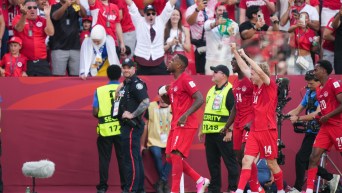 Canadian players celebrate Cyle Larin's goal on Friday