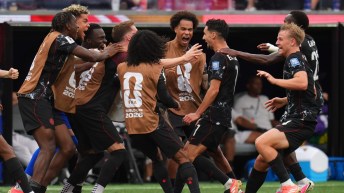 Canada players celebrate a goal against South Africa