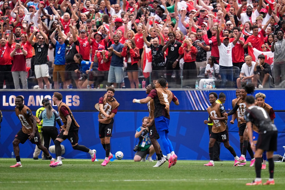 Canada players and fans celebrate the game-winning goal