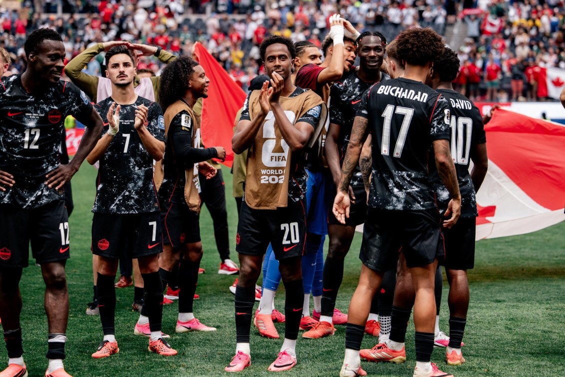 Team Canada players celebrate after the win over South Africa.
