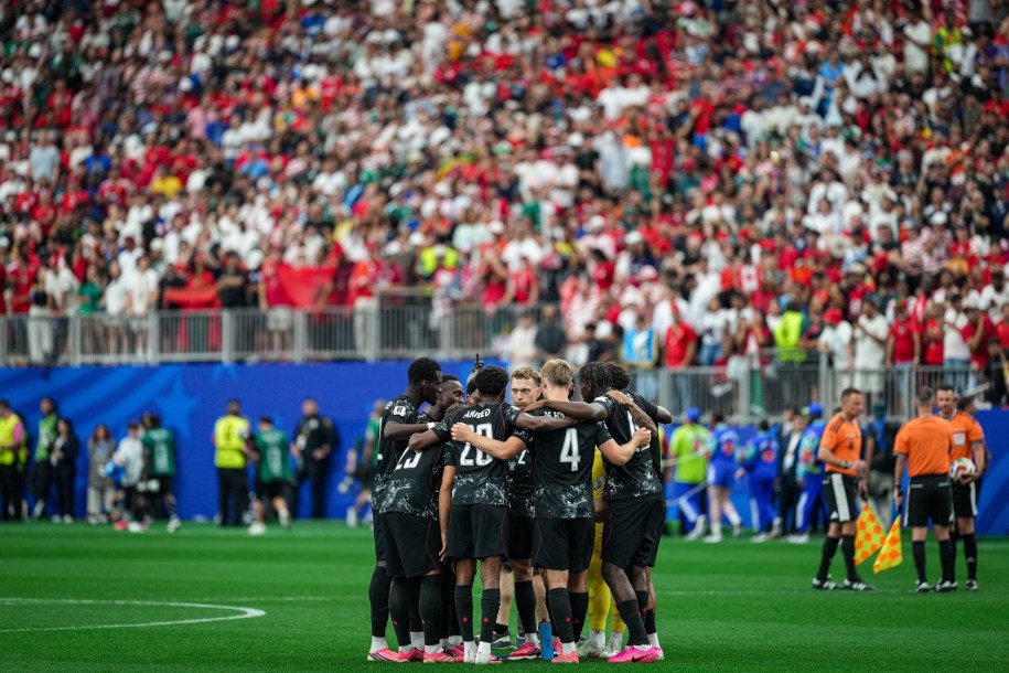 Canada players huddle before the match against Morocco