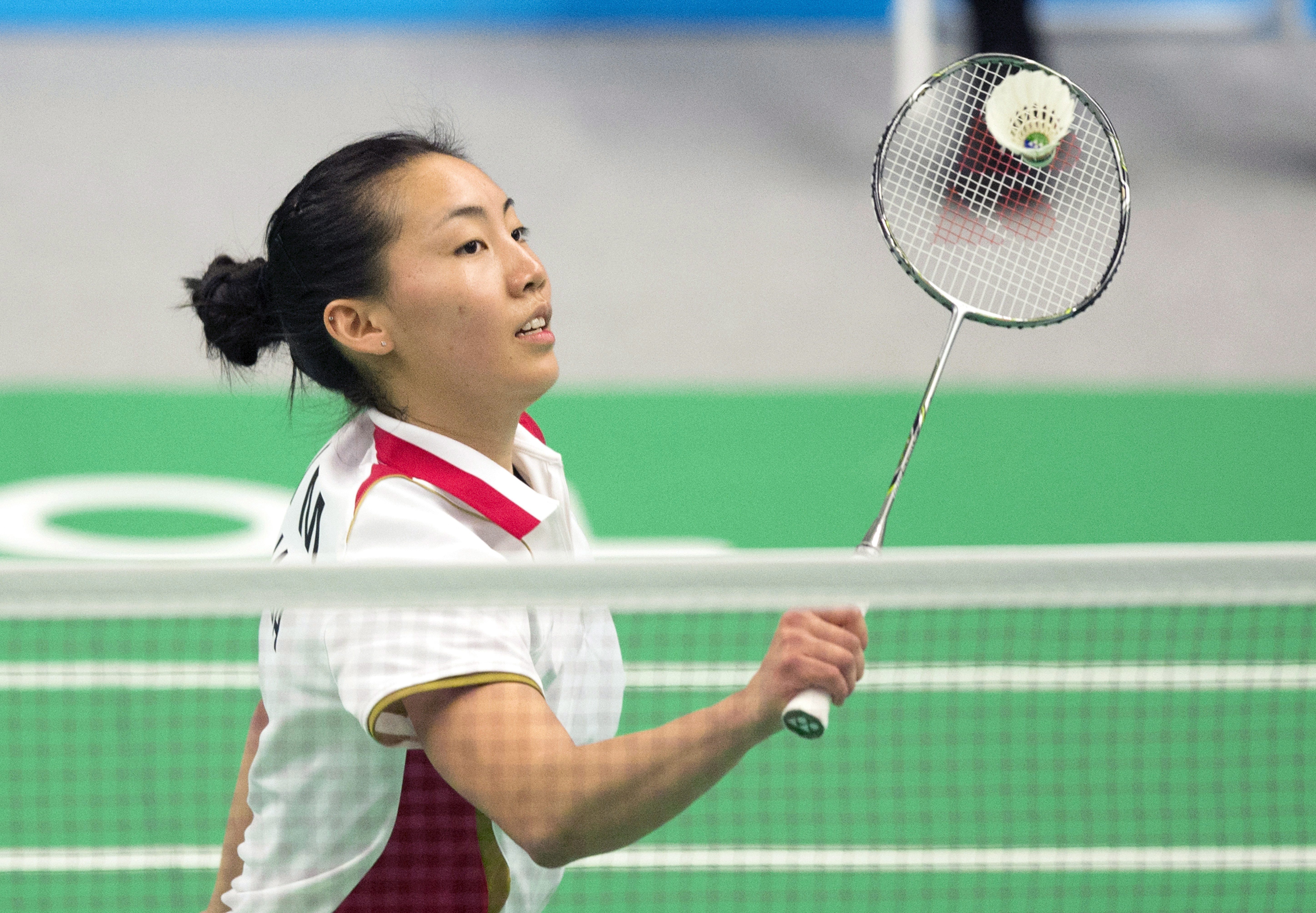 Michelle Li of Canada hits a return during women's singles badminton action against Rachel Honderich of Canada at the 2015 Pan Am Games in Markham, Ont., on Thursday, July 16, 2015. THE CANADIAN PRESS/Darren Calabrese