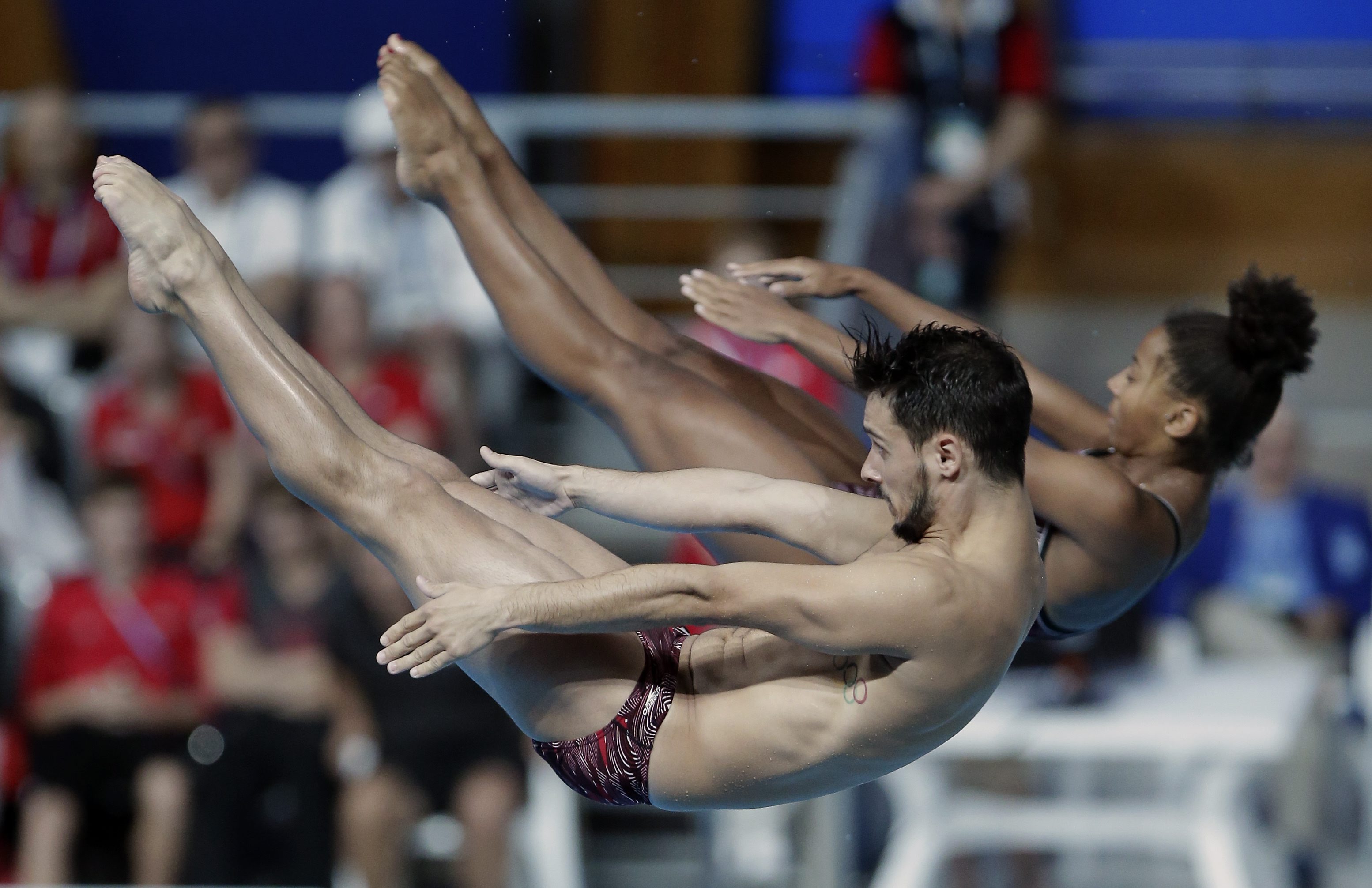 Canada's silver medalists Jennifer Abel and Francois Imbeau-Dulac perform during the mixed 3 m synchro springboard final at the Swimming World Championships in Kazan, Russia, Sunday, Aug. 2, 2015. (AP Photo/Michael Sohn)