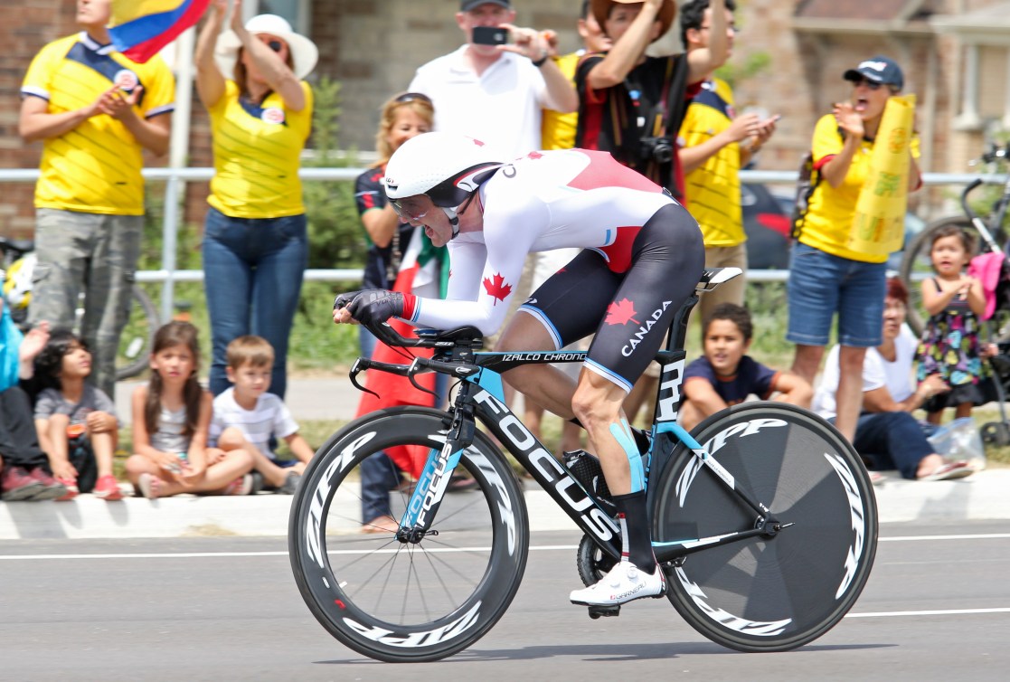 Hugo Houle of Ste-Perpetue, Que. races to gold in the cycling time trial at the Pan American Games in Milton, Ont., Tuesday, July 21, 2015. Photo by Mike Ridewood/COC