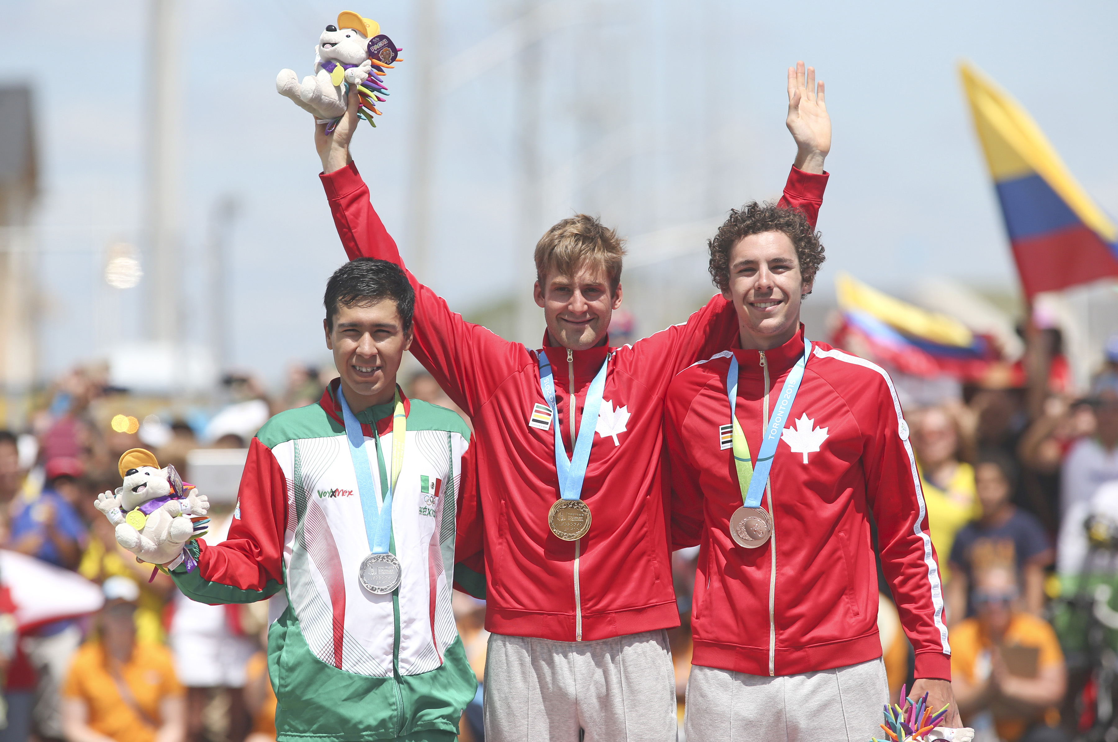 Medalist, from left Ignacio Prado of Mexico, silver, Hugo Houle of Ste-Perpetue, Que, gold and Sean MacKinnon of Hamilton, Ont.. bronze, in the cycling time trial at the Pan American Games in Milton, Ont., Tuesday, July 21, 2015. Photo by Mike Ridewood/COC