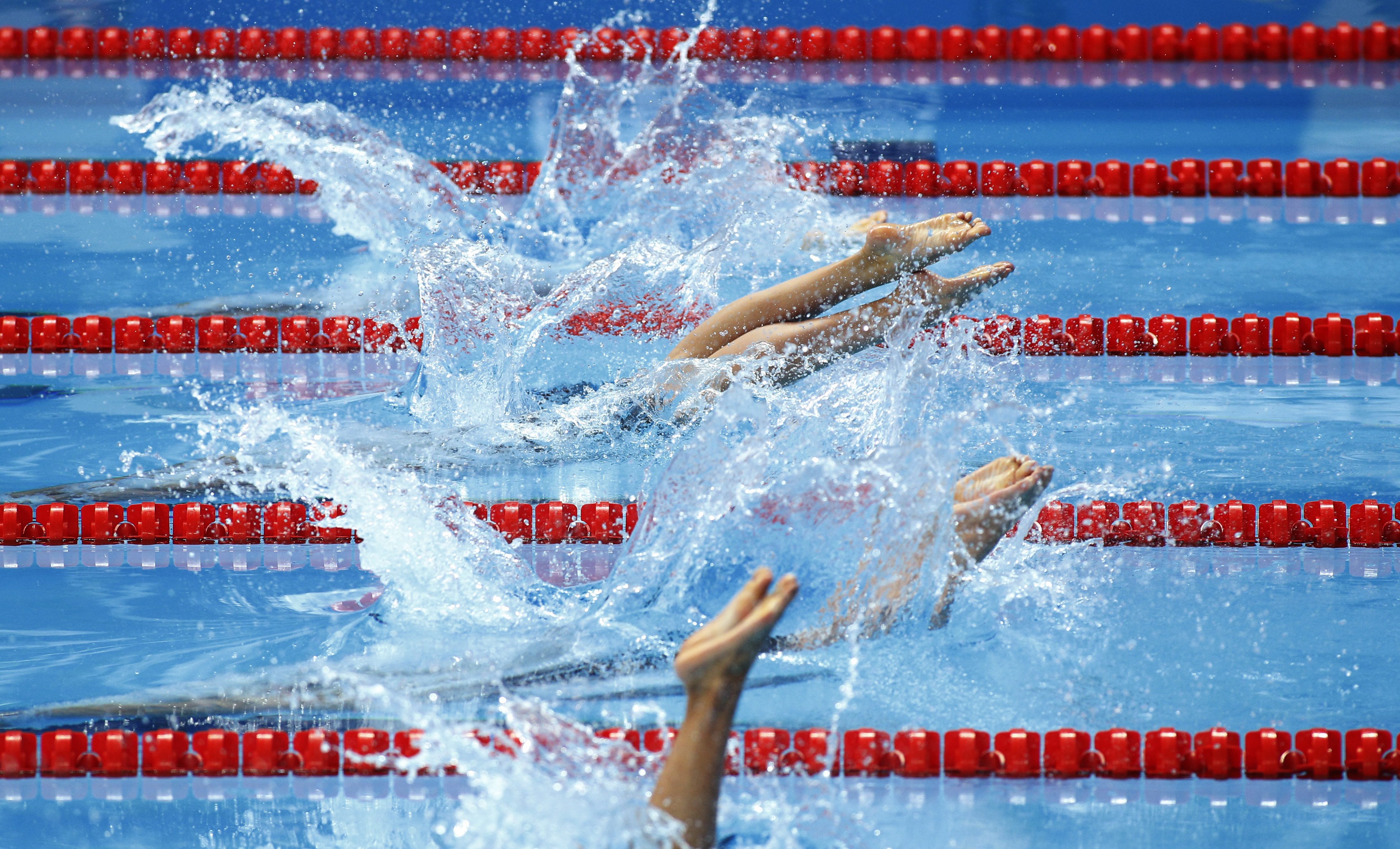 Athletes start a women's 4x200m freestyle relay heat at the Swimming World Championships in Kazan, Russia, Thursday, Aug. 6, 2015. (AP Photo/Sergei Grits)