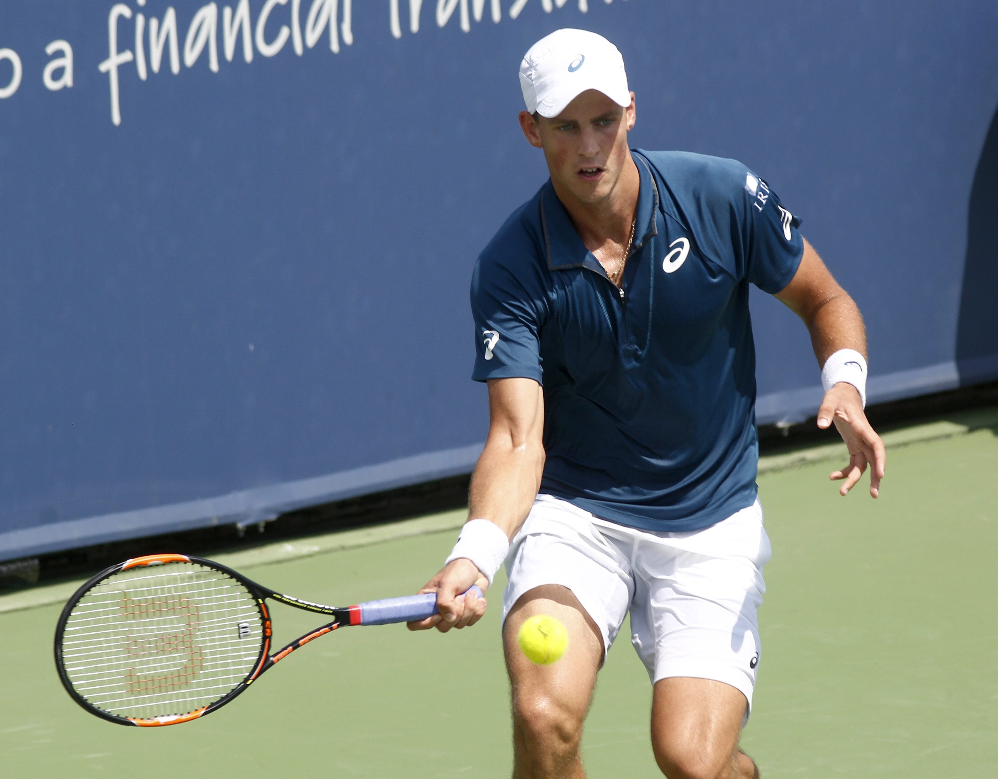 Vasek Pospisil, of Canada, returns to Grigor Dimitrov, of Bulgaria, at the Western & Southern Open tennis tournament, Tuesday, Aug. 18, 2015, in Mason, Ohio. (AP Photo/David Kohl)