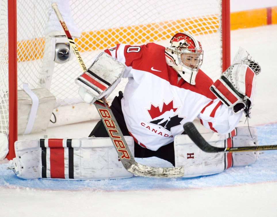 Team Canada's goaltender Emerance Maschmeyer makes a glove save during first period action against Team USA at the women's world hockey championships Monday, March 28, 2016 in Kamloops, B.C. THE CANADIAN PRESS/Ryan Remiorz