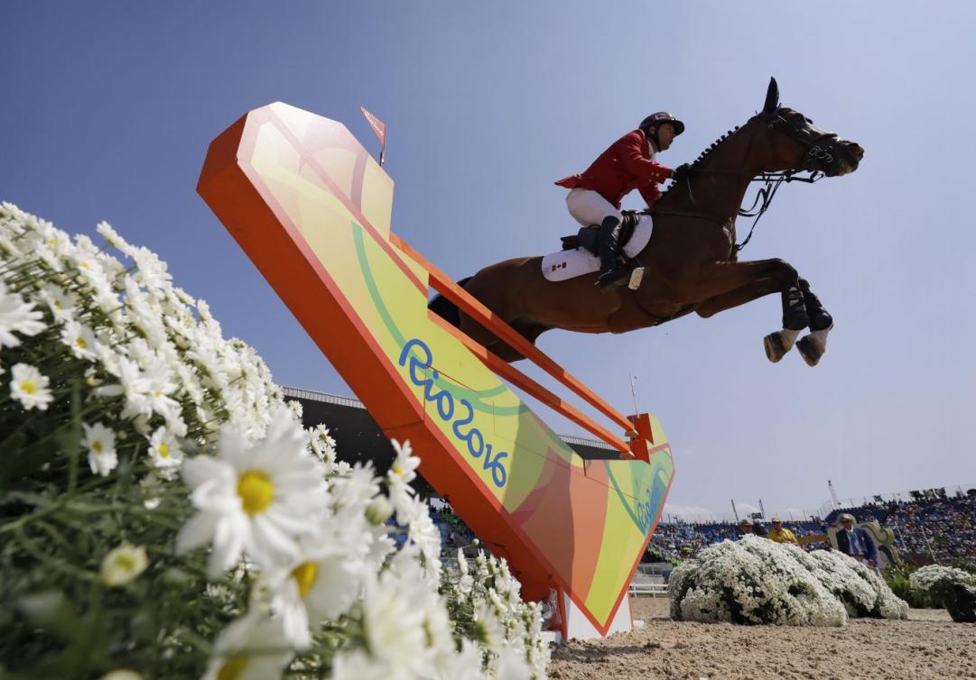 Eric Lamaze lors de la finale de saut d'obstacles aux Jeux olympiques de Rio, le 19 août 2016. (AP Photo/John Locher)